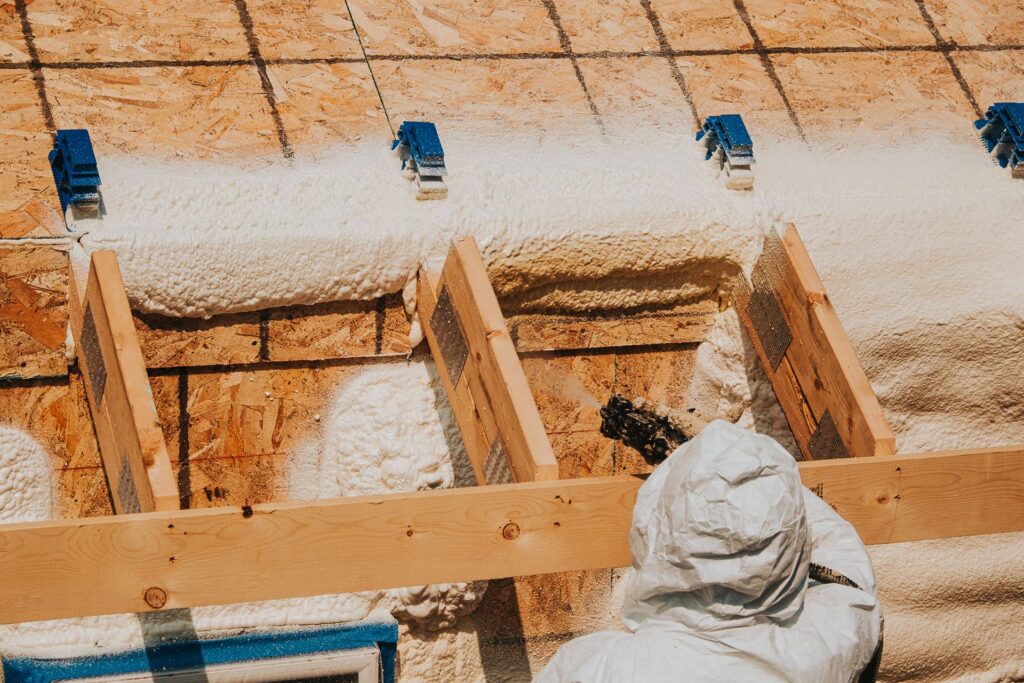 spraying foam on the X-bracket system